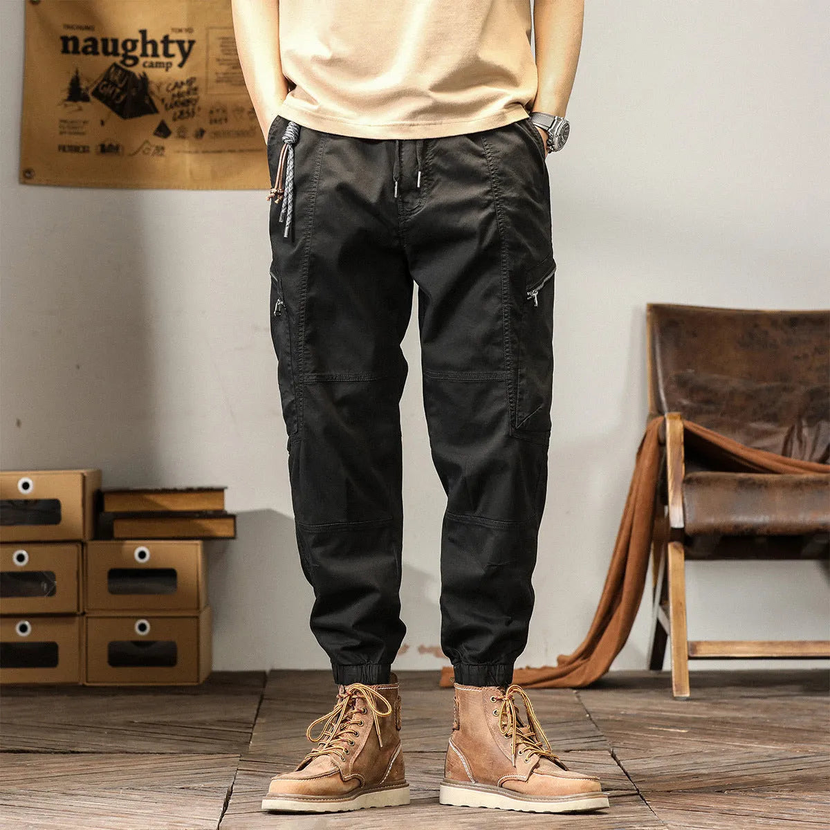 Men's loose khaki cotton harem trousers with tapered leg and ankle banding.