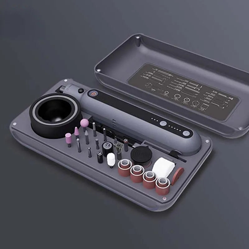 Mini electric polishing and cutting grinder set with lithium battery on a workbench.