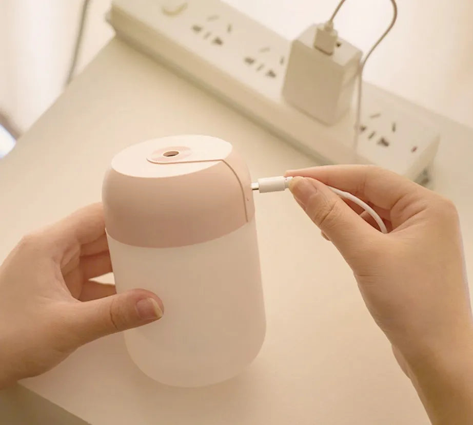 White cylindrical USB-powered humidifier with aromatherapy function on desk