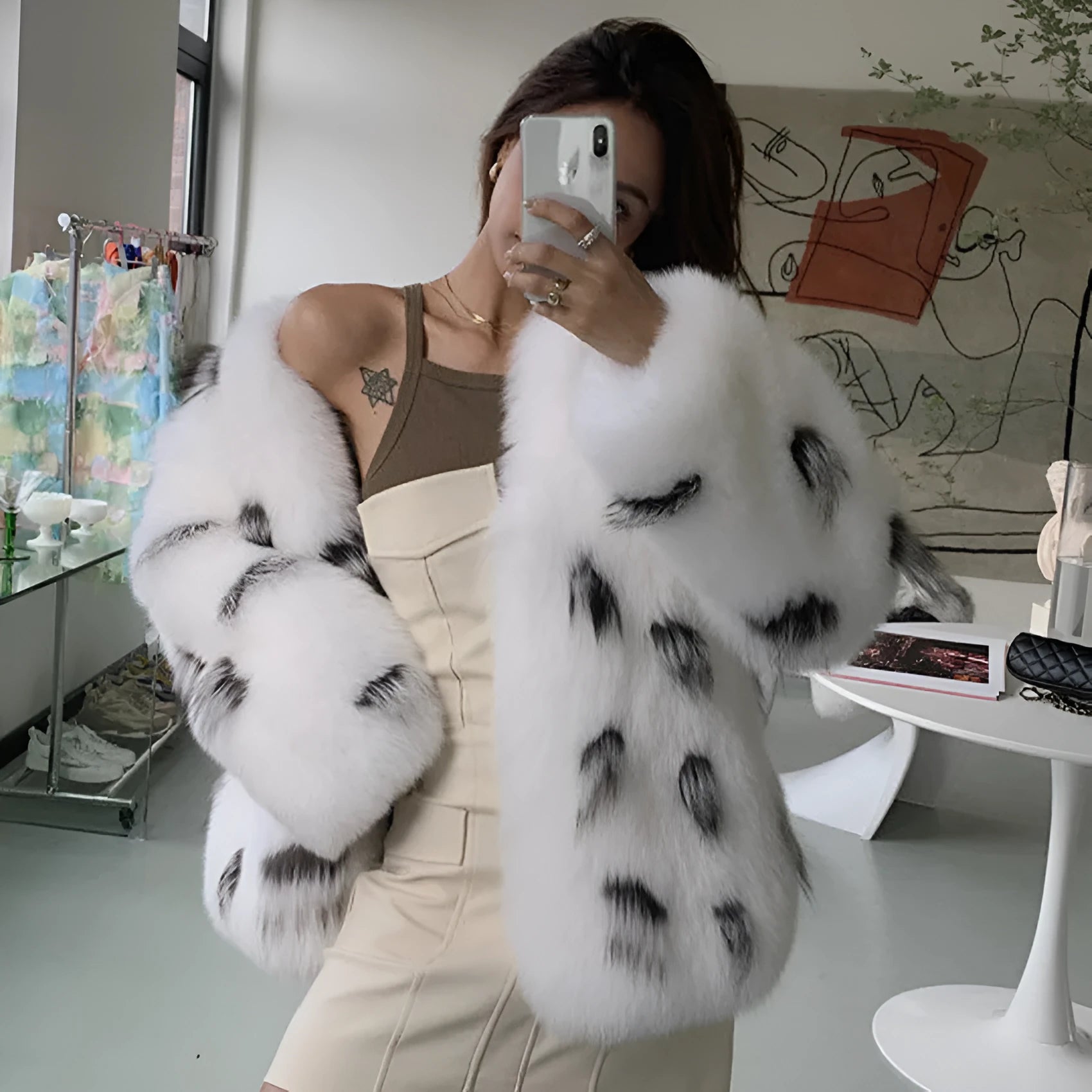 Black and white faux fur plus size coat for women with short length and regular sleeves.