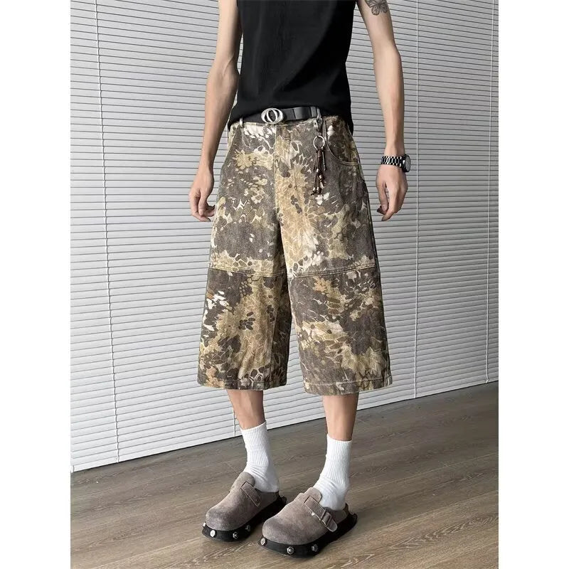 Yellow snake pattern camouflage cropped jeans on hanger showing tooling detail