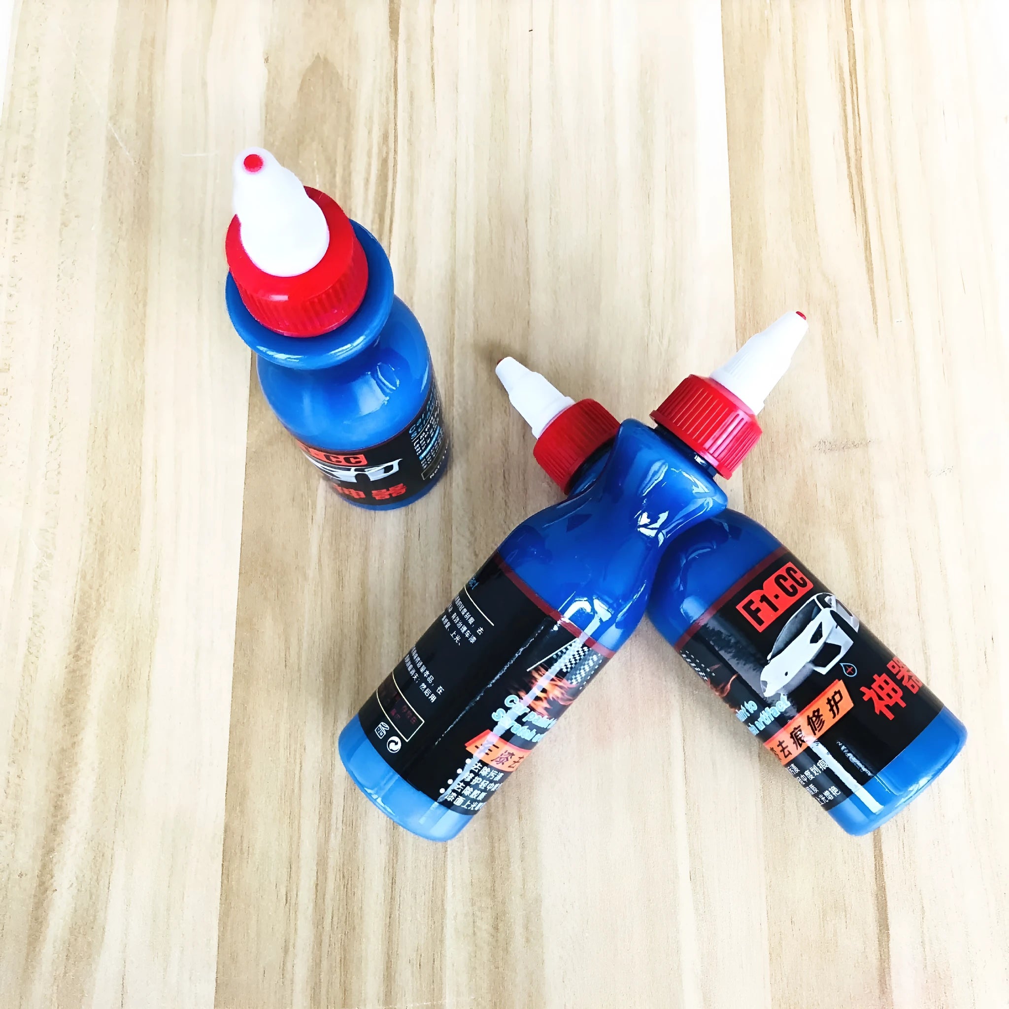 Small blue car scratch repair wiping tool kit with applicator pad and repair agent bottle