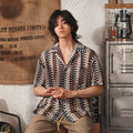 Men's grey Japanese style Cuban collar short sleeve shirt with jacquard texture, shown on a model.