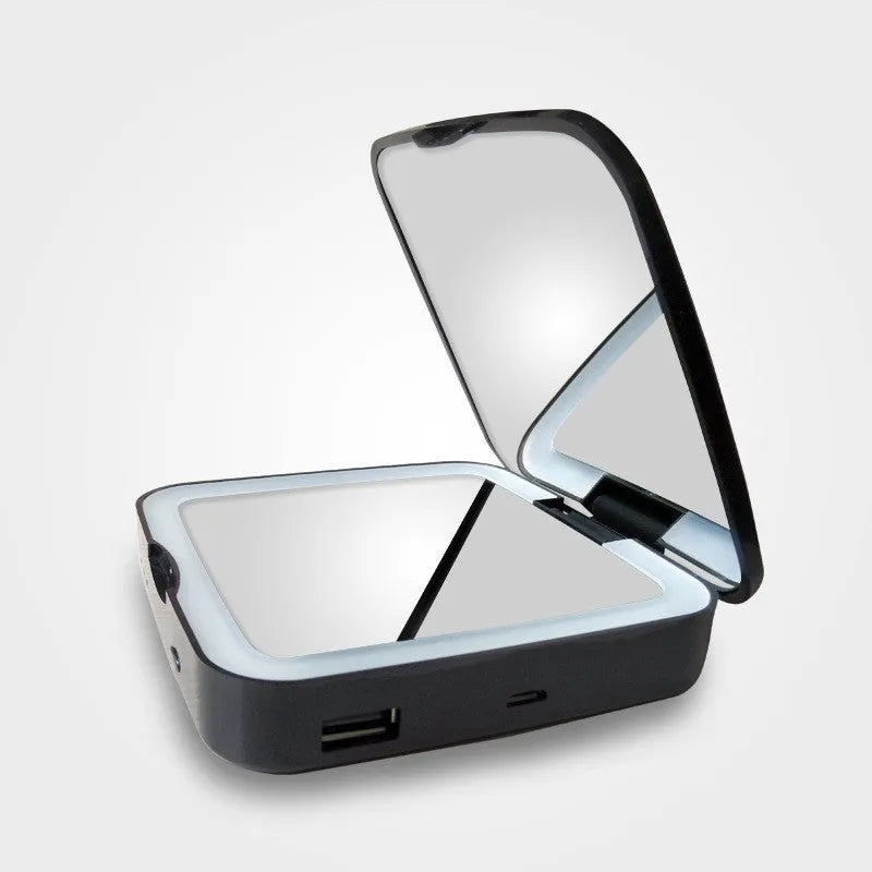 Black and white makeup mirror with adjustable lighting and 4x magnification