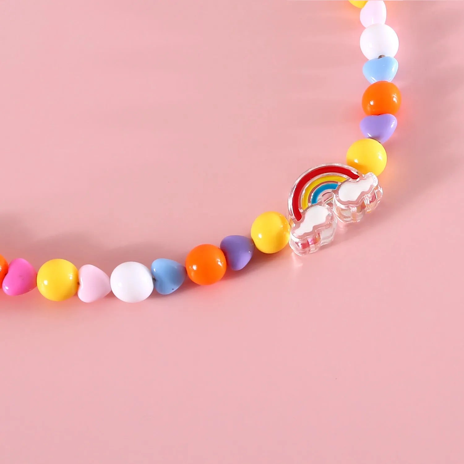 Colourful plastic bead pet necklace in peach, rainbow, or small flower patterns with adjustable sizing.