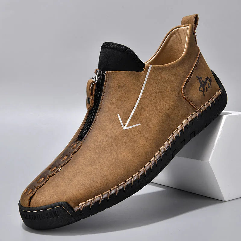 Men's black leather zip-up boots with hand-stitched detailing and round toe