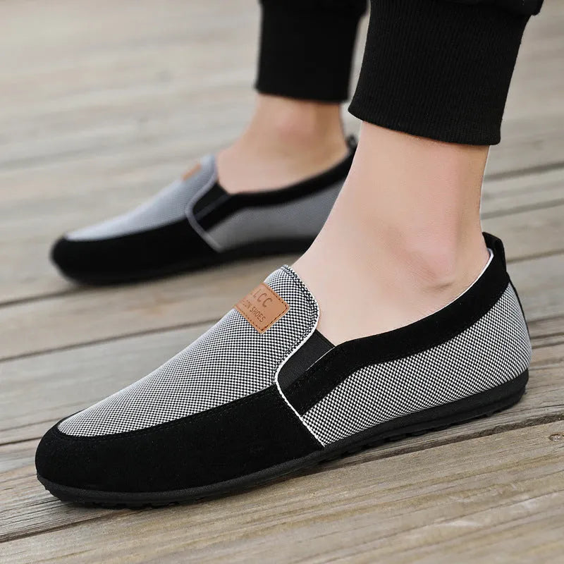 Men's grey and khaki canvas casual board shoes with round toe and stitching detail.