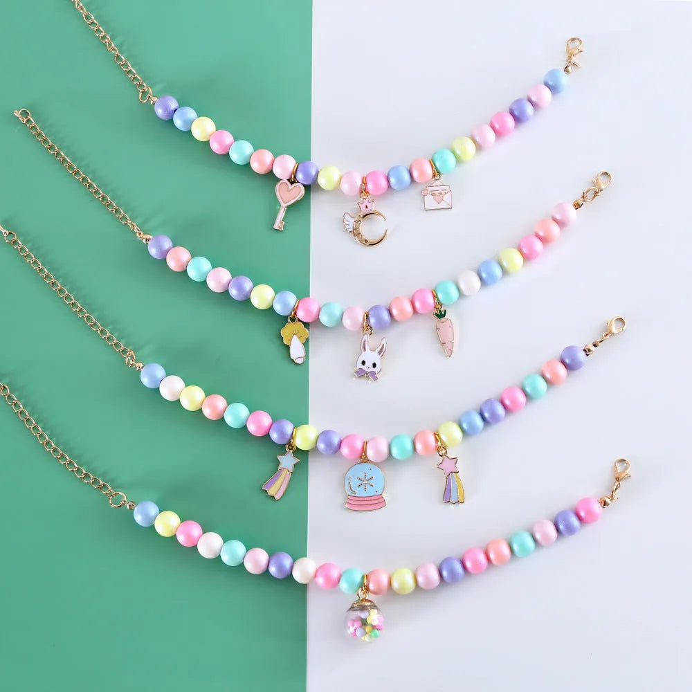 Pastel macaron charm pet collar with moon and rabbit designs on adjustable resin band for cats and dogs