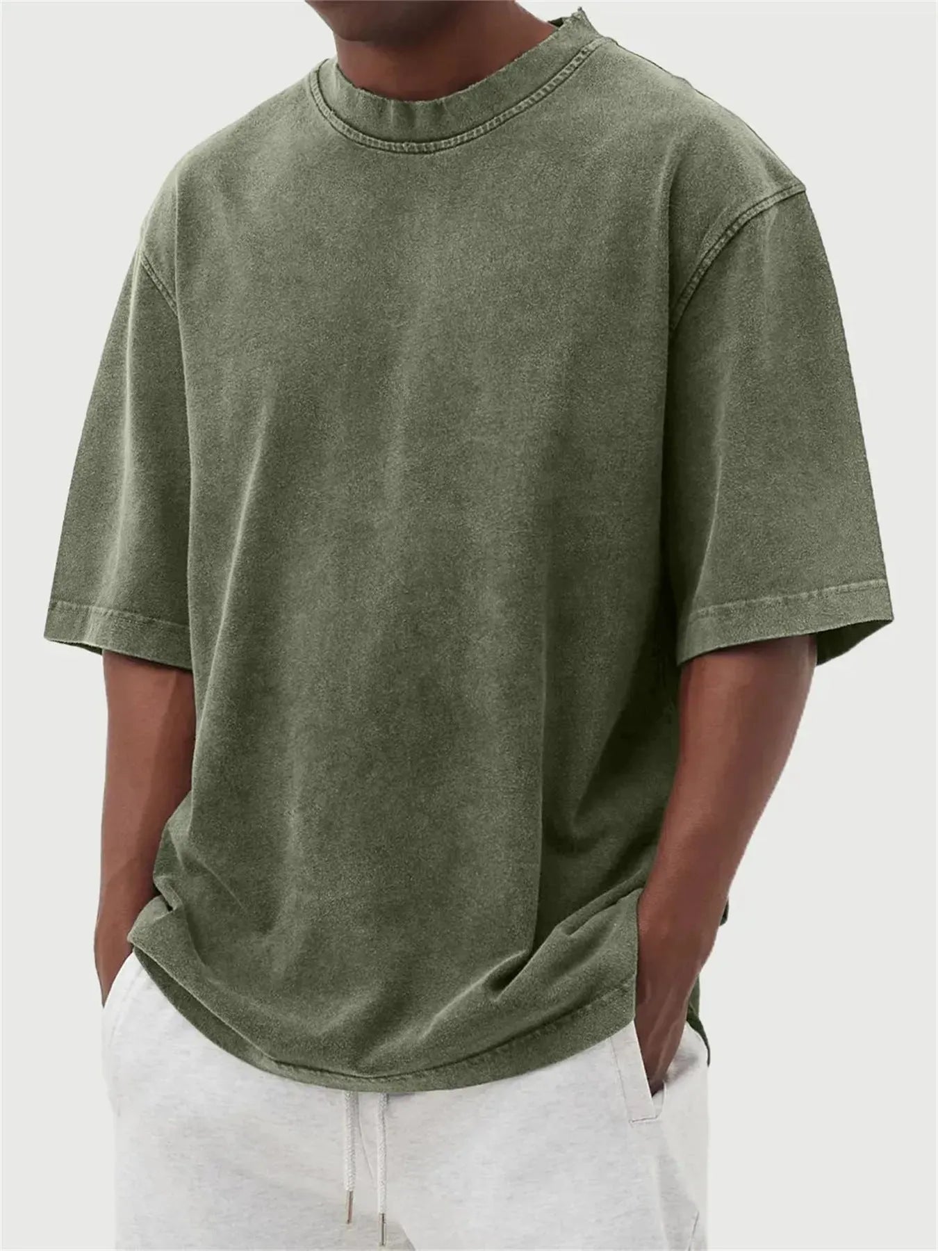 Men's distressed stone wash pullover T-shirt in loose fit with half sleeves available in multiple solid colours