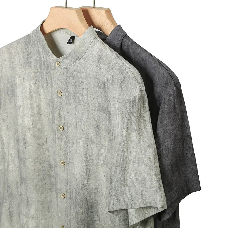 Men's loose grey linen cardigan shirt with a stand collar on a hanger.
