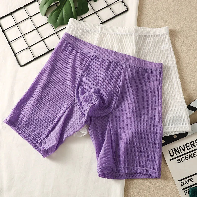 Men's solid colour lace boxer briefs with a lengthened hip-lifting design on a white background.