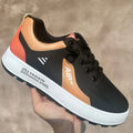 Men's casual shoes with round toe and artificial PU upper in white with black, white with brown, and white with orange colour options