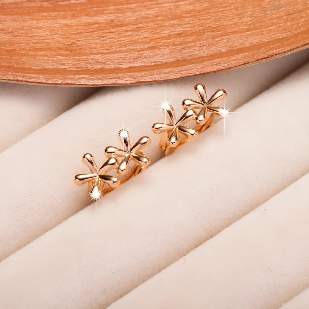 Rose gold circular stud earrings with a waterdrop flower design for women.