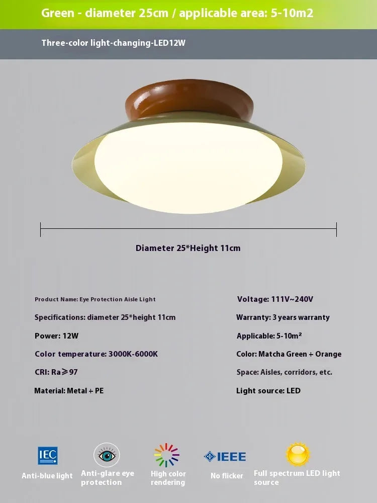 Modern cream-style flying saucer shaped ceiling lamp in a bedroom setting.