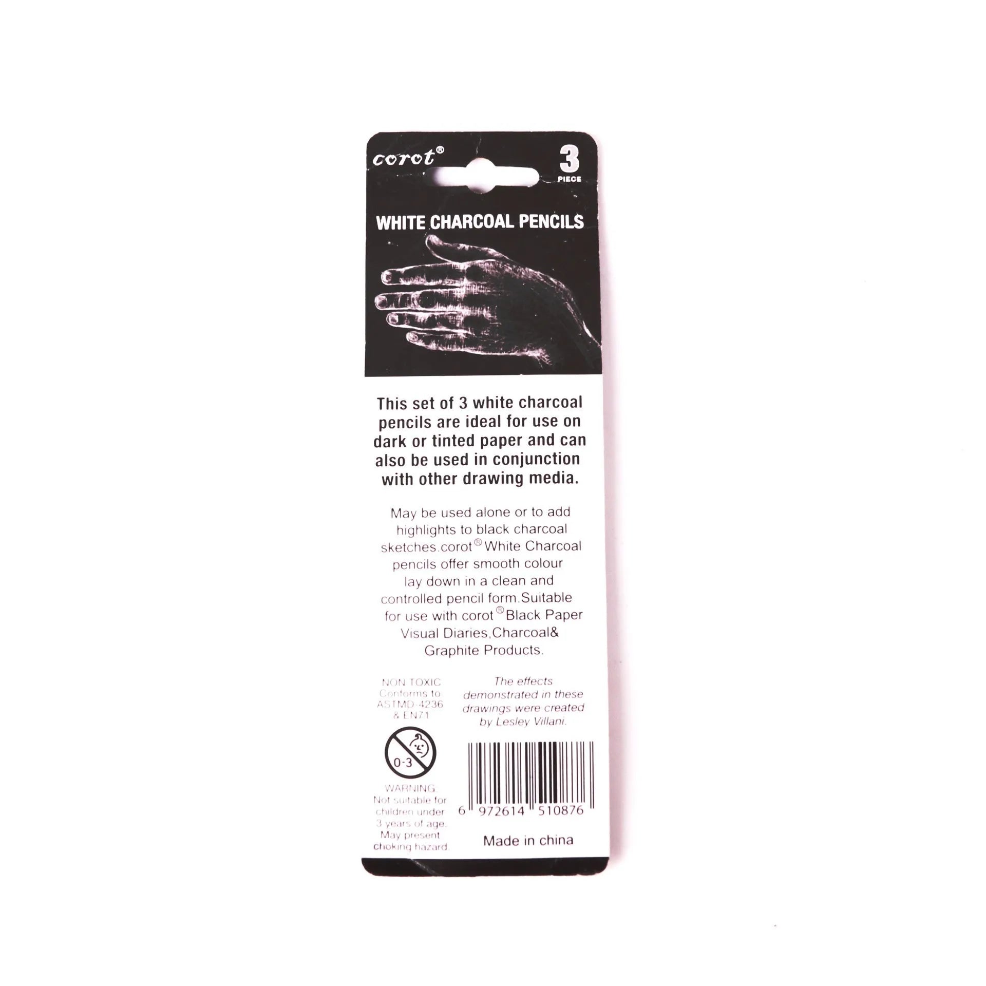 Three white charcoal pencils with wooden casings for drawing on dark paper