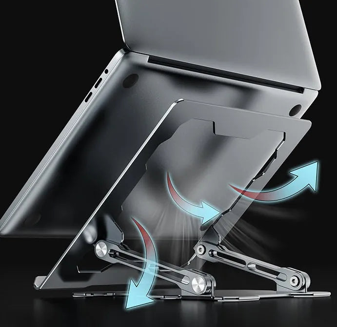 Grey aluminium folding laptop stand holding a silver laptop at an angle on a wooden desk.