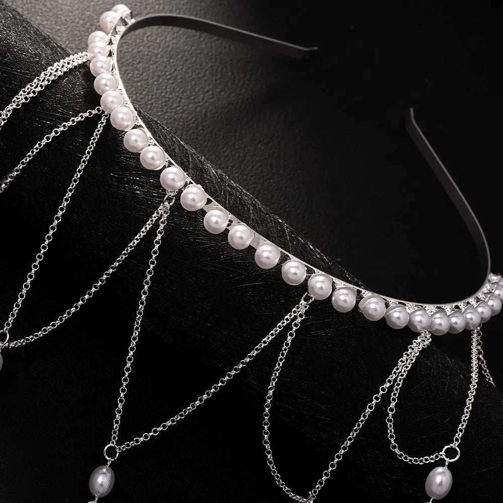Women's gold mesh tassel hair chain with pearl decorations on dark hair