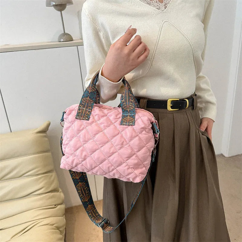 Soft horizontal square Oxford cloth shoulder messenger bag in green with embroidery detail and a single strap.