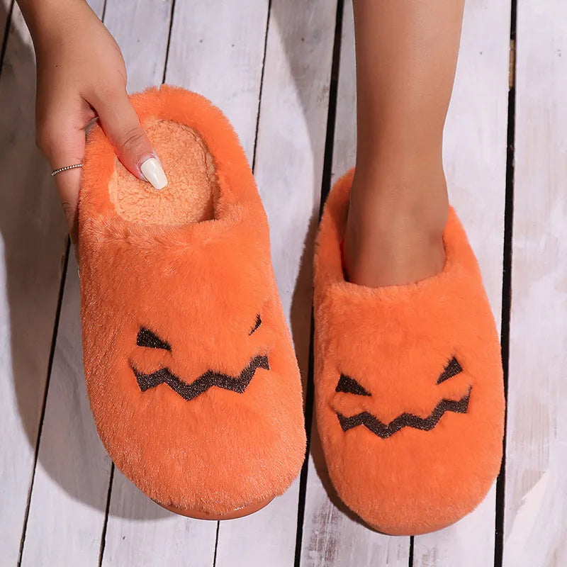 Orange Halloween pumpkin slippers with coral velvet upper and plush lining on non-slip PVC soles