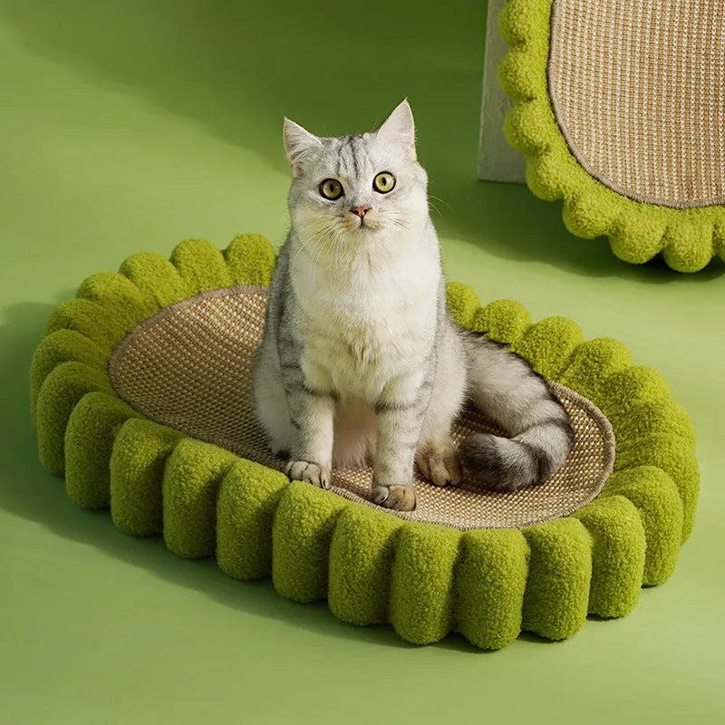 Green oval cat scratcher bowl bed with sisal scratching surface measuring 65cm