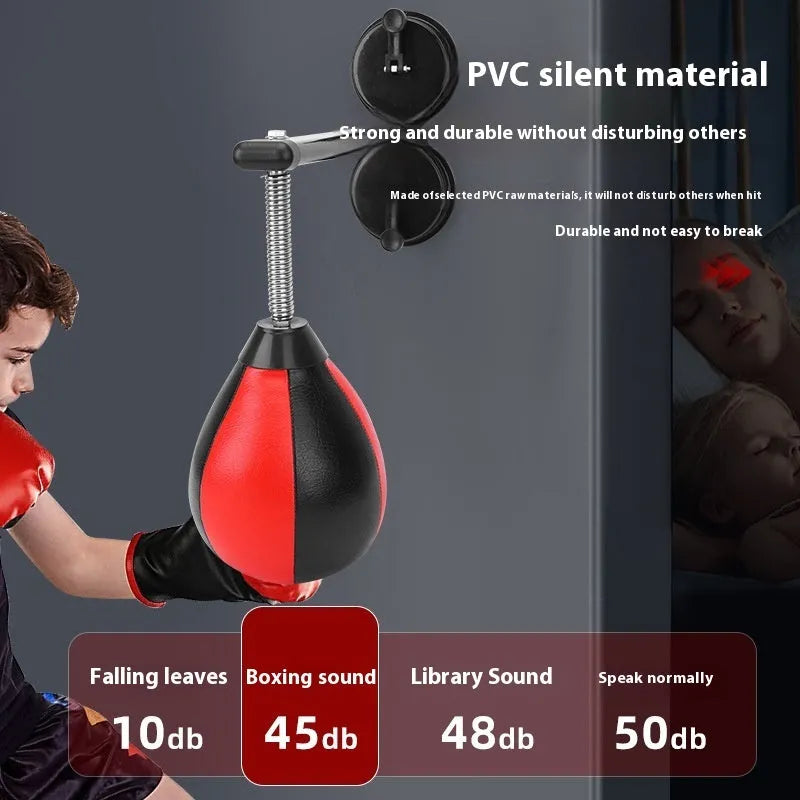Pear-shaped black PU boxing reaction ball mounted on a wall with double suction cups for home training.