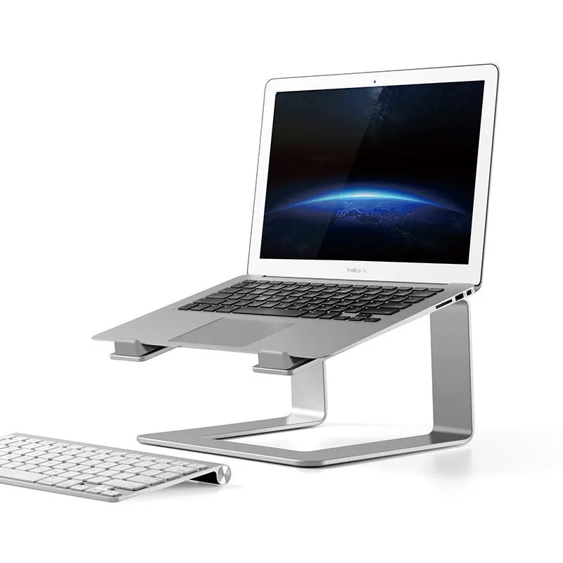 Black aluminium alloy laptop stand on a desk, elevating a silver laptop.