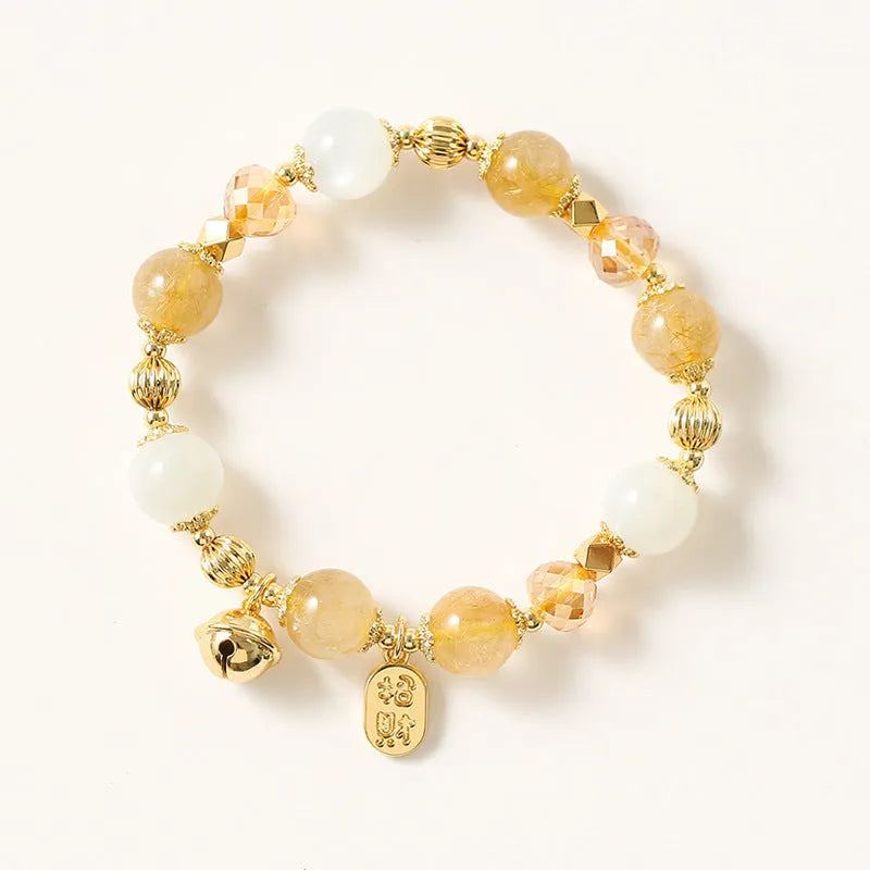 Gold electroplated rutilated quartz bracelet showing Korean style design and lucky fortune gold colour