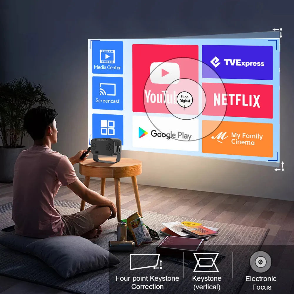 Black Android smart portable HD projector with remote control on table
