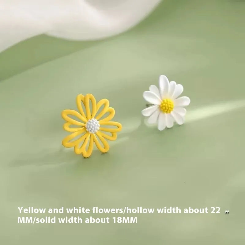 Cartoon style flower stud earrings made from alloy in blue and orange two-tone colours.