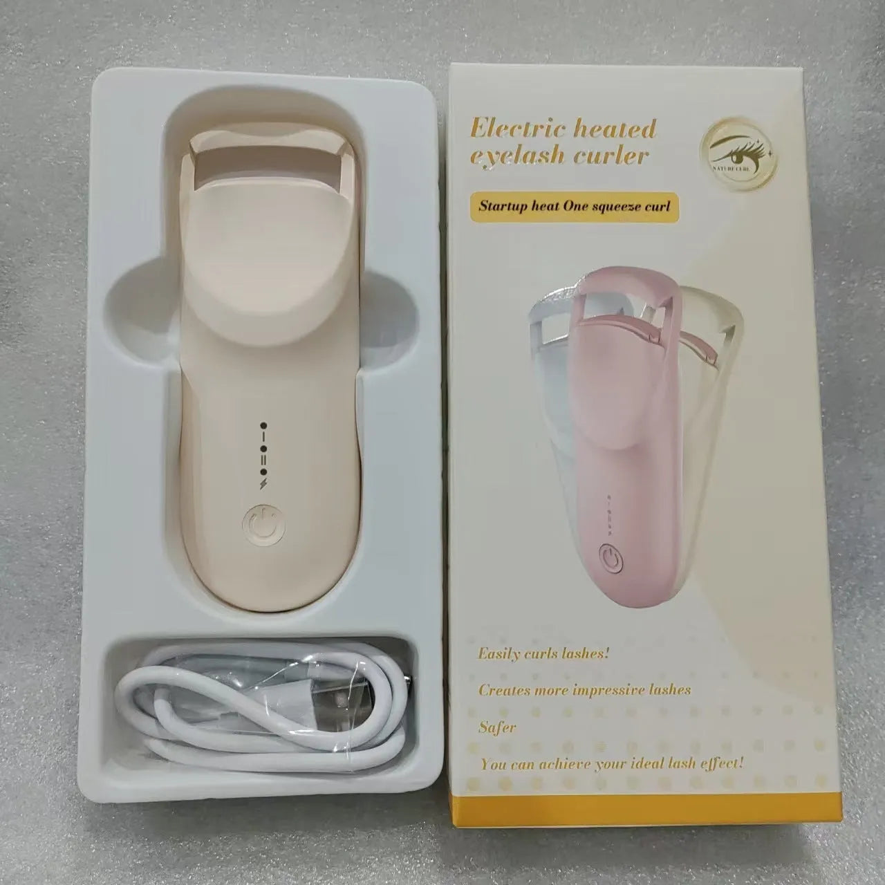 USB rechargeable electric eyelash curler in cream white, maca pink, or vanilla apricot colour with ceramic heating plate.