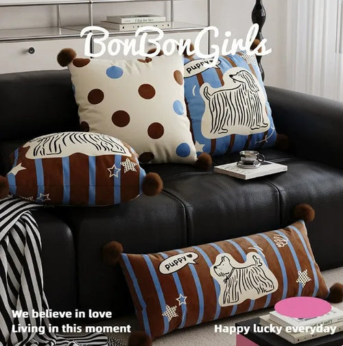 Blue cartoon animal print square sofa cushion with removable pillowcase on a grey sofa.