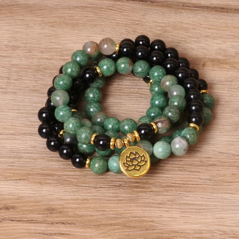 Green and black elastic beaded long bracelet with alloy components