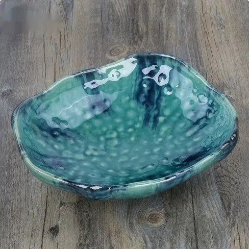 Creative Japanese style irregular shaped porcelain sashimi bowl with floral decoration and a small sauce dish