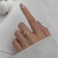 Geometric copper branch leaf ring for women in gold or silver electroplated finish.