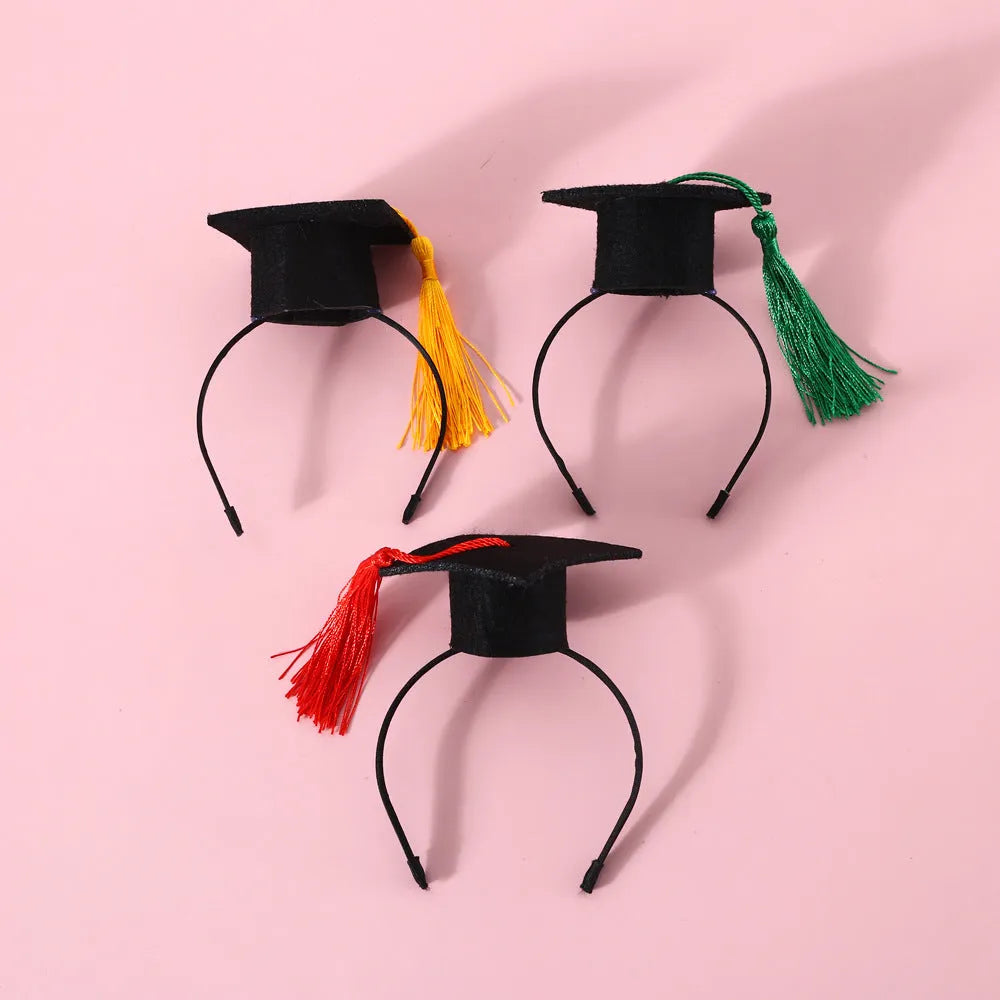 Small pet wearing an elastic wool felt hair band and matching doctor's degree bow tie.