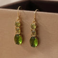 Green geometric quadrilateral copper earrings with retro bohemian styling for unisex wear