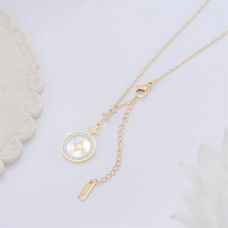Gold titanium steel necklace with hexagonal star pendant on O-ring chain.