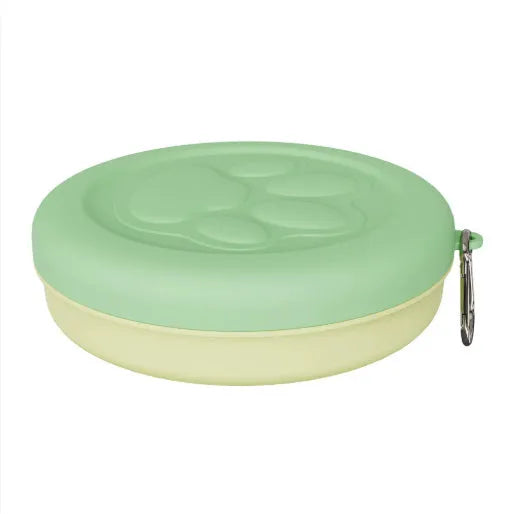 Portable dog feeding bowl with snack compartment lid in light green colour