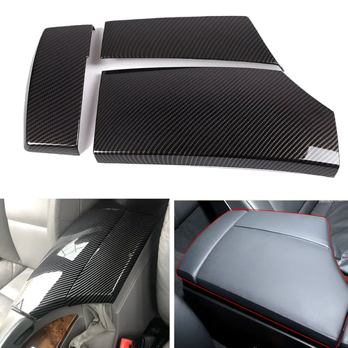 Set of three black ABS protective covers with a carbon fibre weave pattern for car armrest boxes.