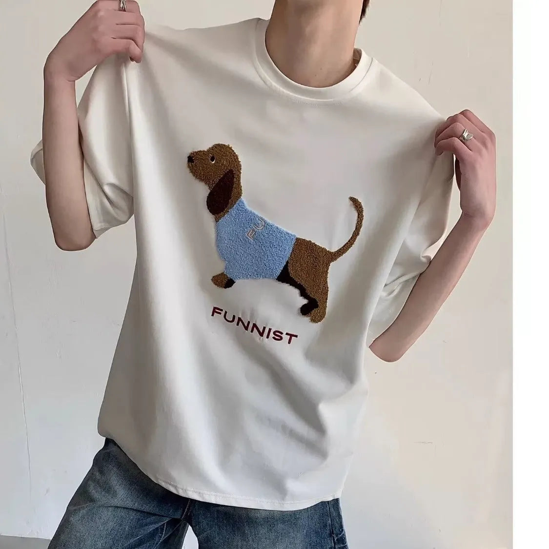 Men's grey cotton t-shirt with an embroidered black and white dachshund dog design on the chest.