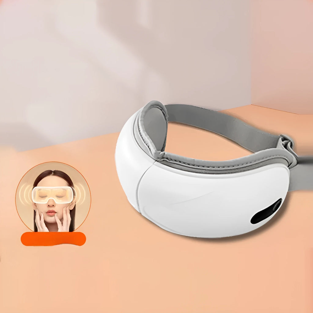 White rechargeable eye massager with airbag massage and hot compress functions on a plain background