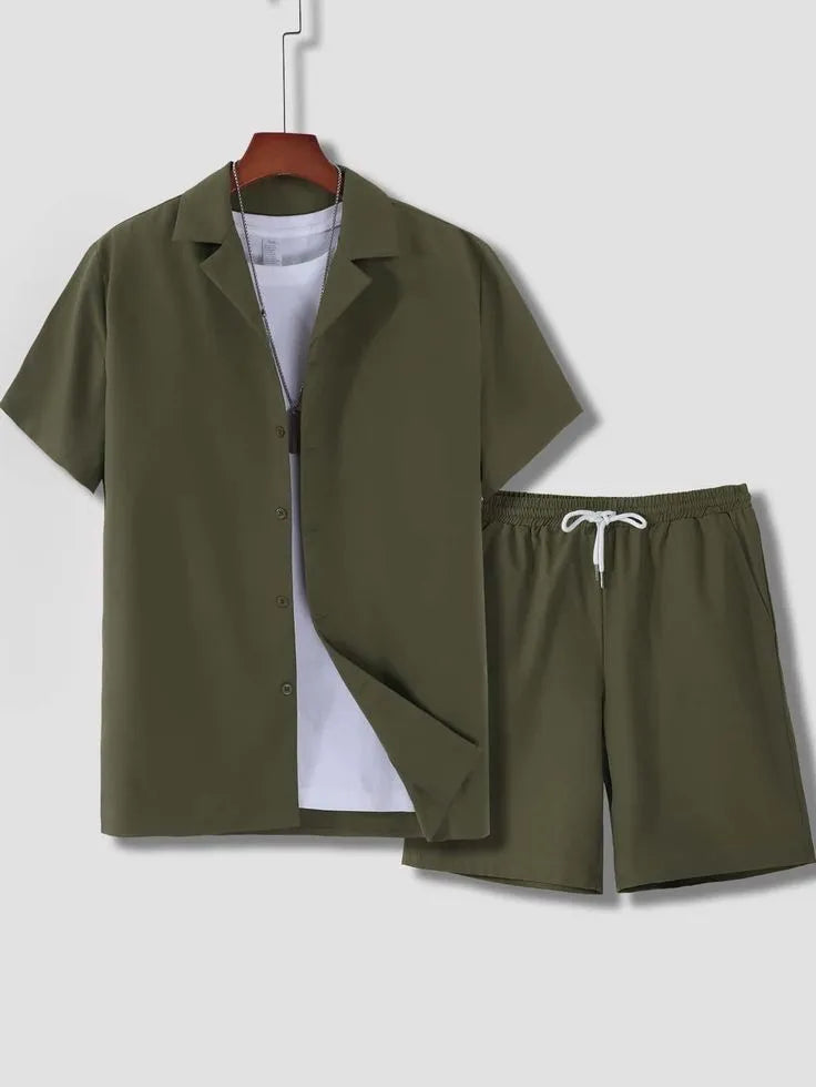 Man wearing a white short sleeve Cuban collar sport shirt and matching shorts from a polyester sport suit set.