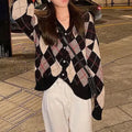 Casual pink knitted cardigan coat with regular sleeves, shown on a hanger.