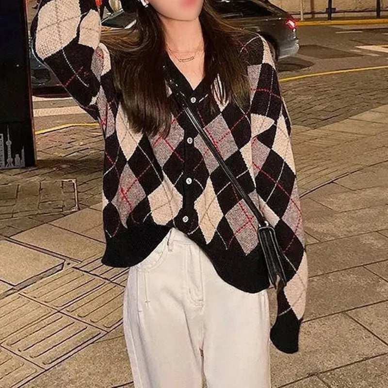 Casual pink knitted cardigan coat with regular sleeves, shown on a hanger.