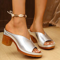 Beige women's casual slippers with a thick heel and round toe design on a white background.