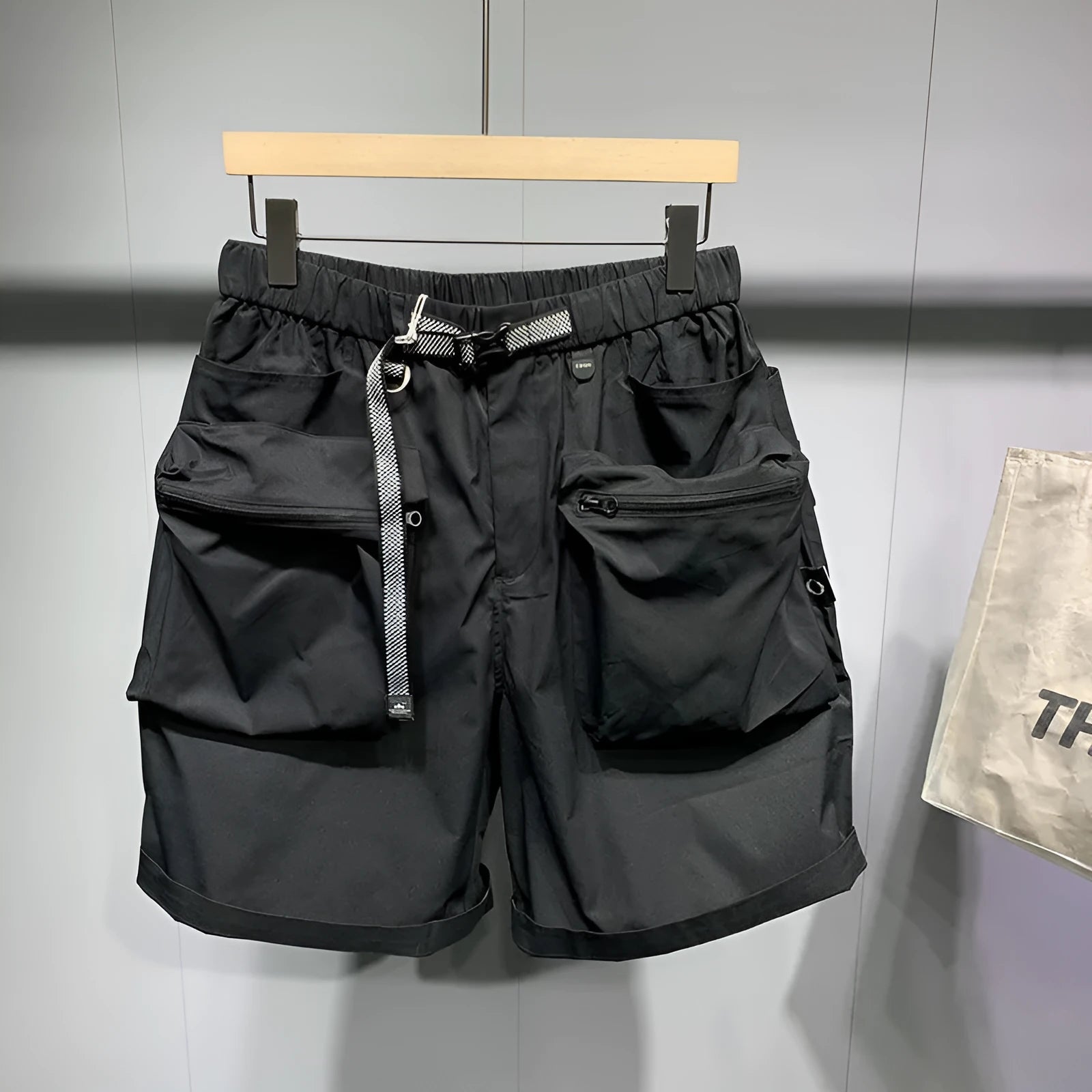 Large size men's black work shorts with pockets and straight leg hem