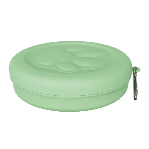 Portable dog feeding bowl with snack compartment lid in light green colour