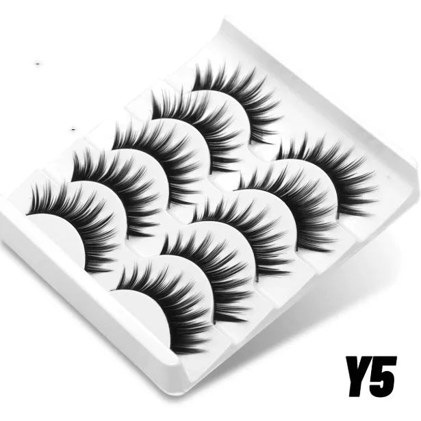 Natural false eyelashes in box with adhesive glue, artificial fibre construction in thick natural long style