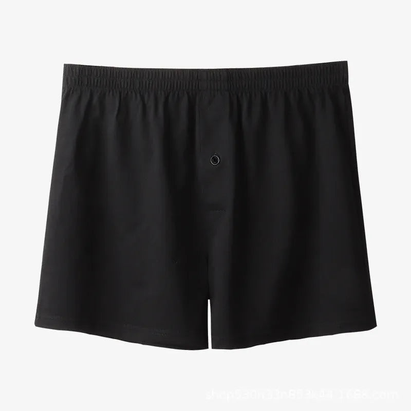 Men's high-waisted loose-fit cotton boxer shorts in black, grey, and navy blue.