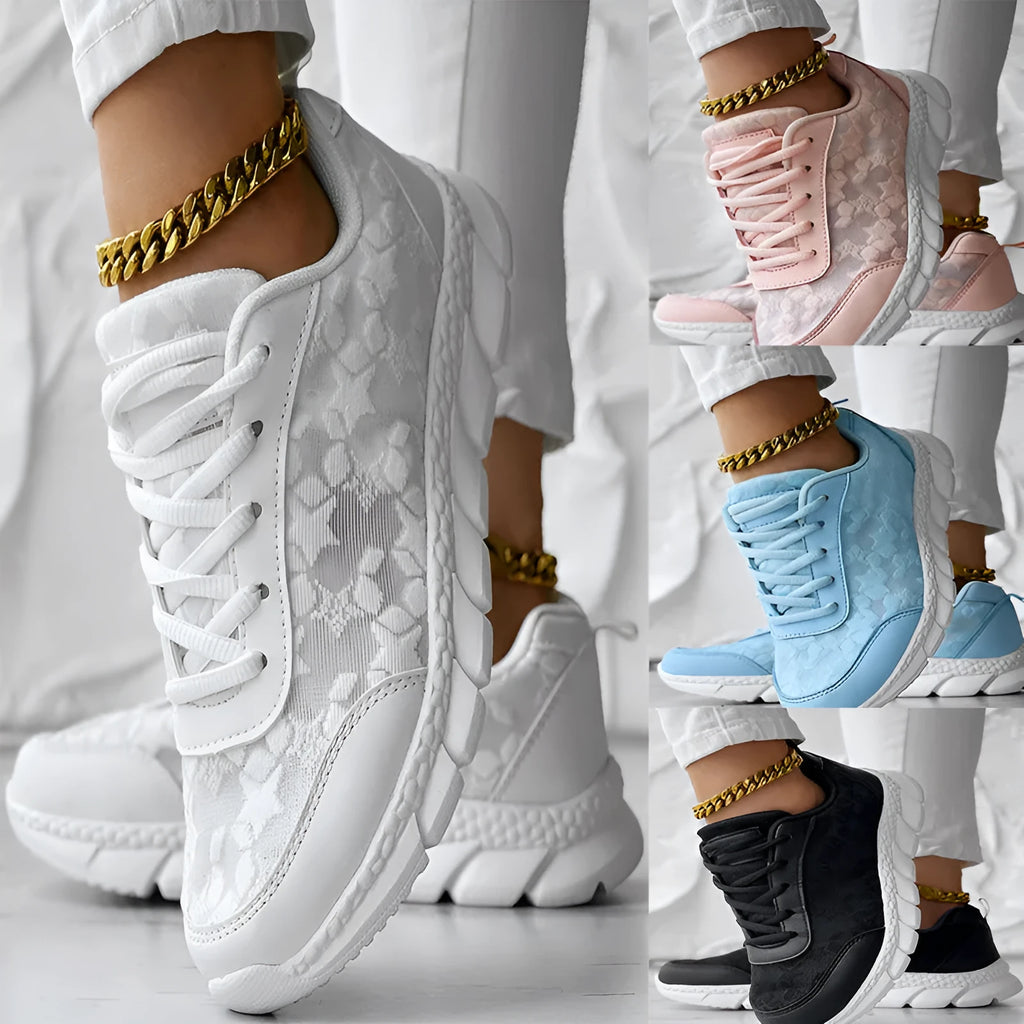 Women's canvas running shoes in white, black, blue, and pink colours with flat heel design